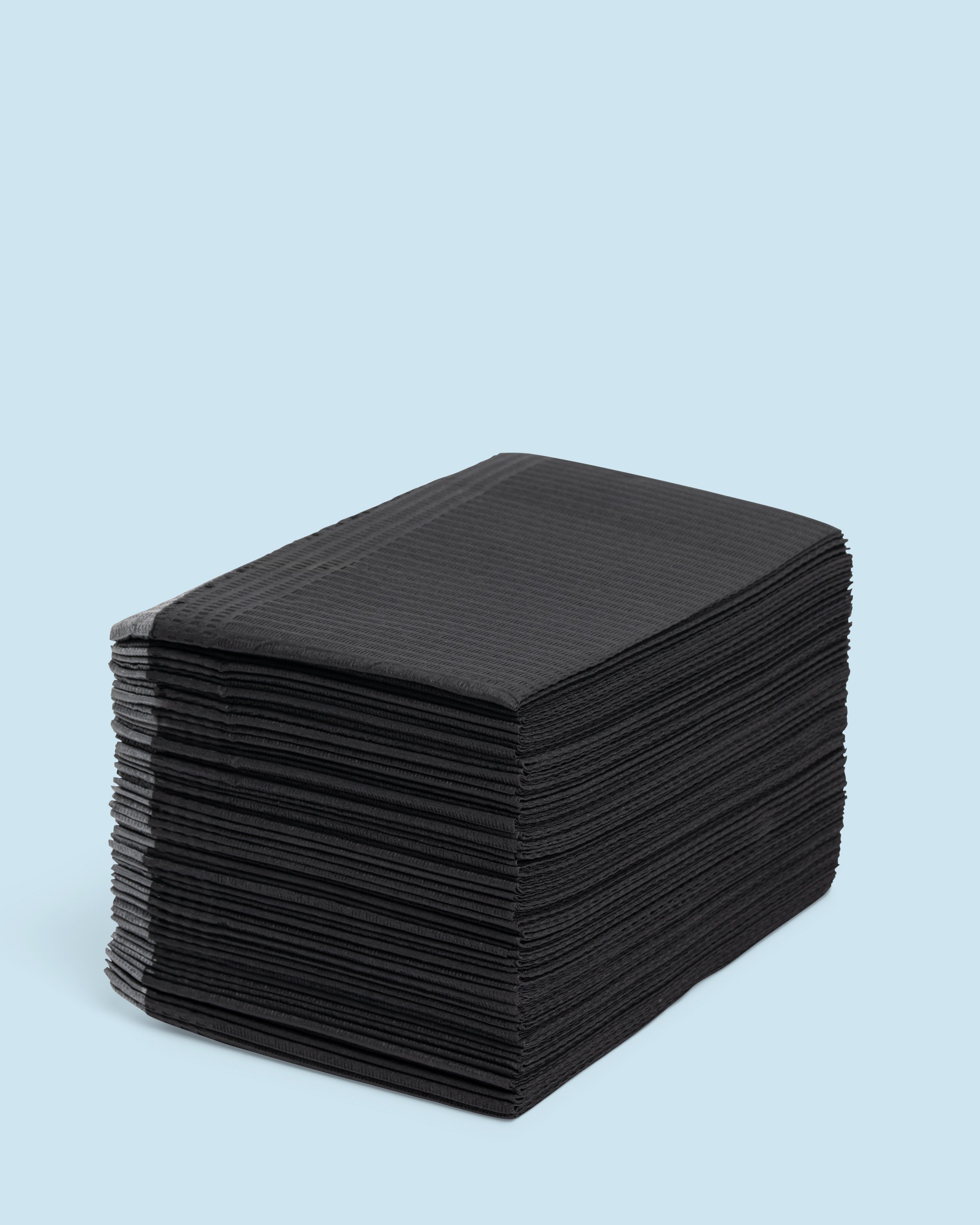 Table towels ‘Black’ 125 pcs – sterke zwarte wegwerpdoekjes voor salongebruik en hygiënische werkoppervlakken.