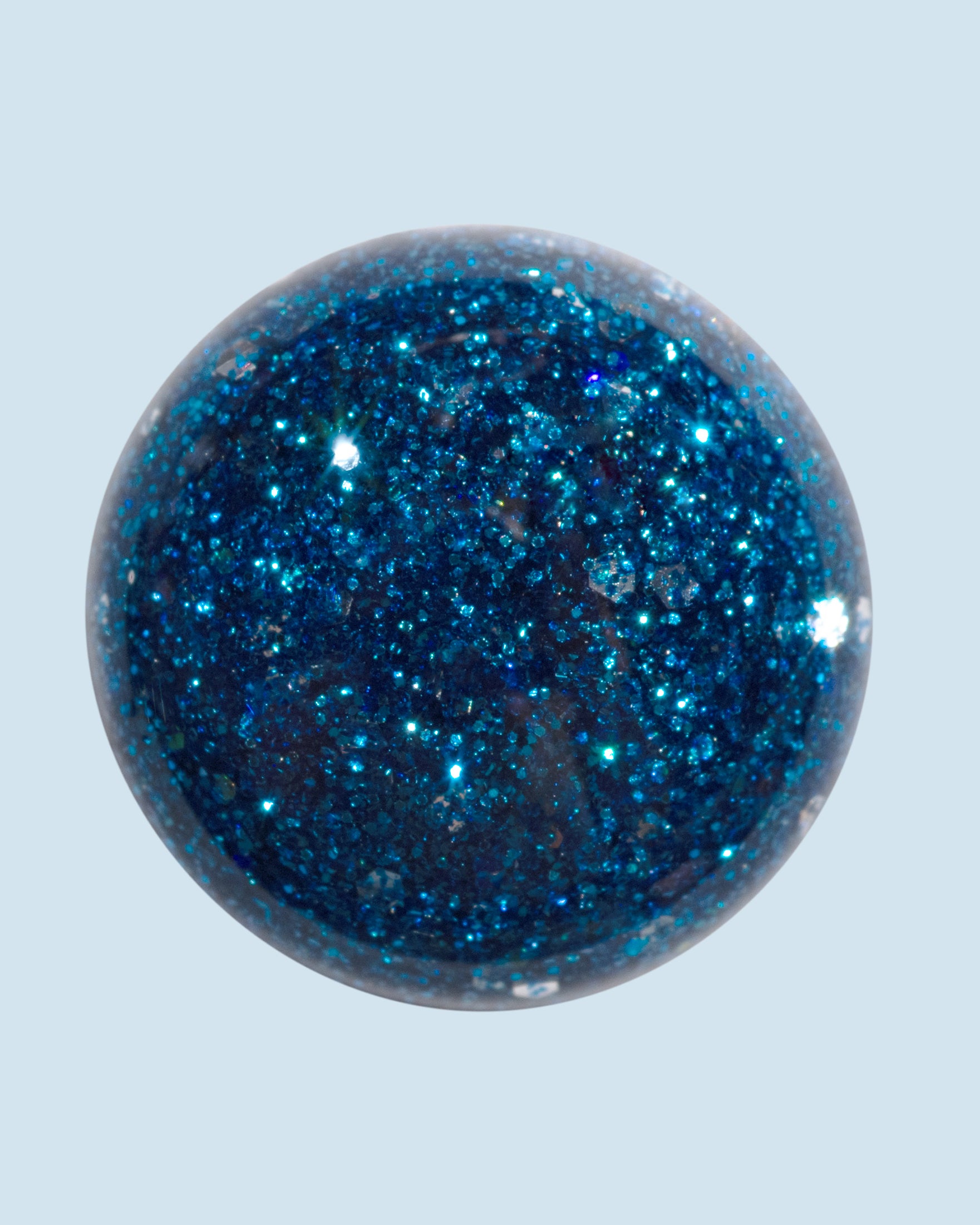 Galaxy Petal glitter gelpolish 15 ml van The Polished, blauwe tint met sprankelende glitterfinish.